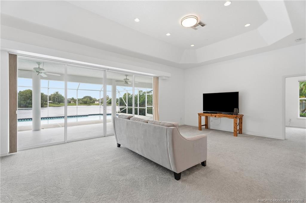 800 Southeast Waterside Way Stuart, FL 34997 - Photo 9 of 27 a living room with furniture and a flat screen tv