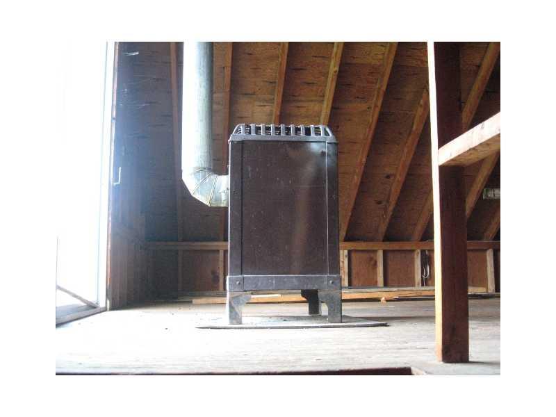 281 Waldoboro Road Bremen, ME 04551 - Photo 21 of 25 Storage. Woodstove with in above...