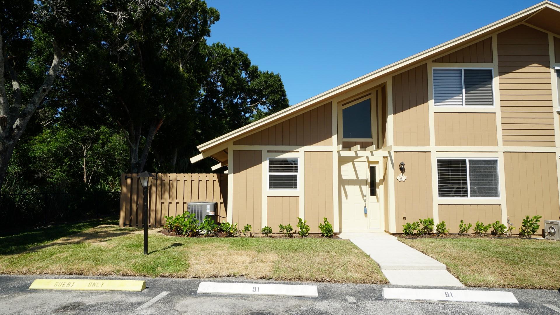 91 Maplecrest Circle Jupiter, FL 33458 - Photo 1 of 27 a front view of a house with a yard