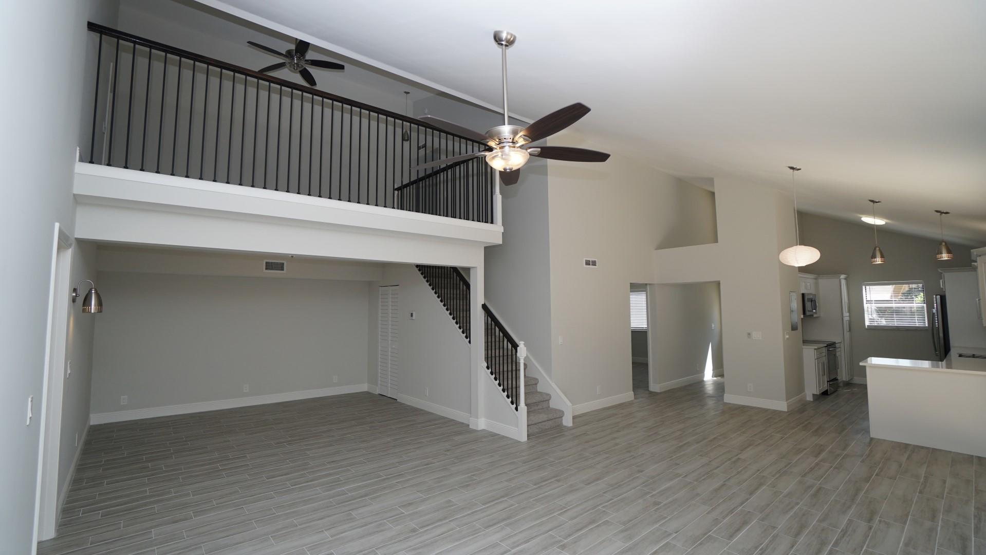91 Maplecrest Circle Jupiter, FL 33458 - Photo 11 of 27 a view of a hallway with wooden floor and workspace
