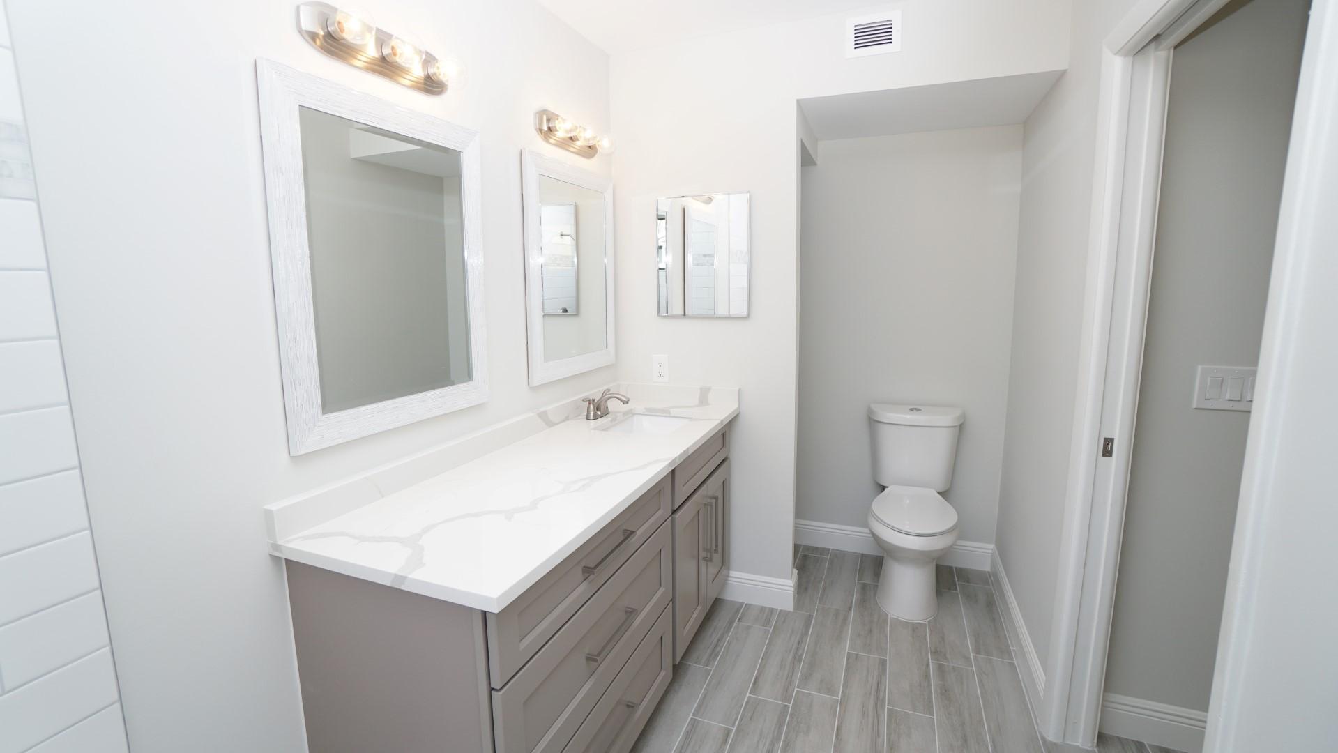 91 Maplecrest Circle Jupiter, FL 33458 - Photo 13 of 27 a bathroom with a sink and a toilet