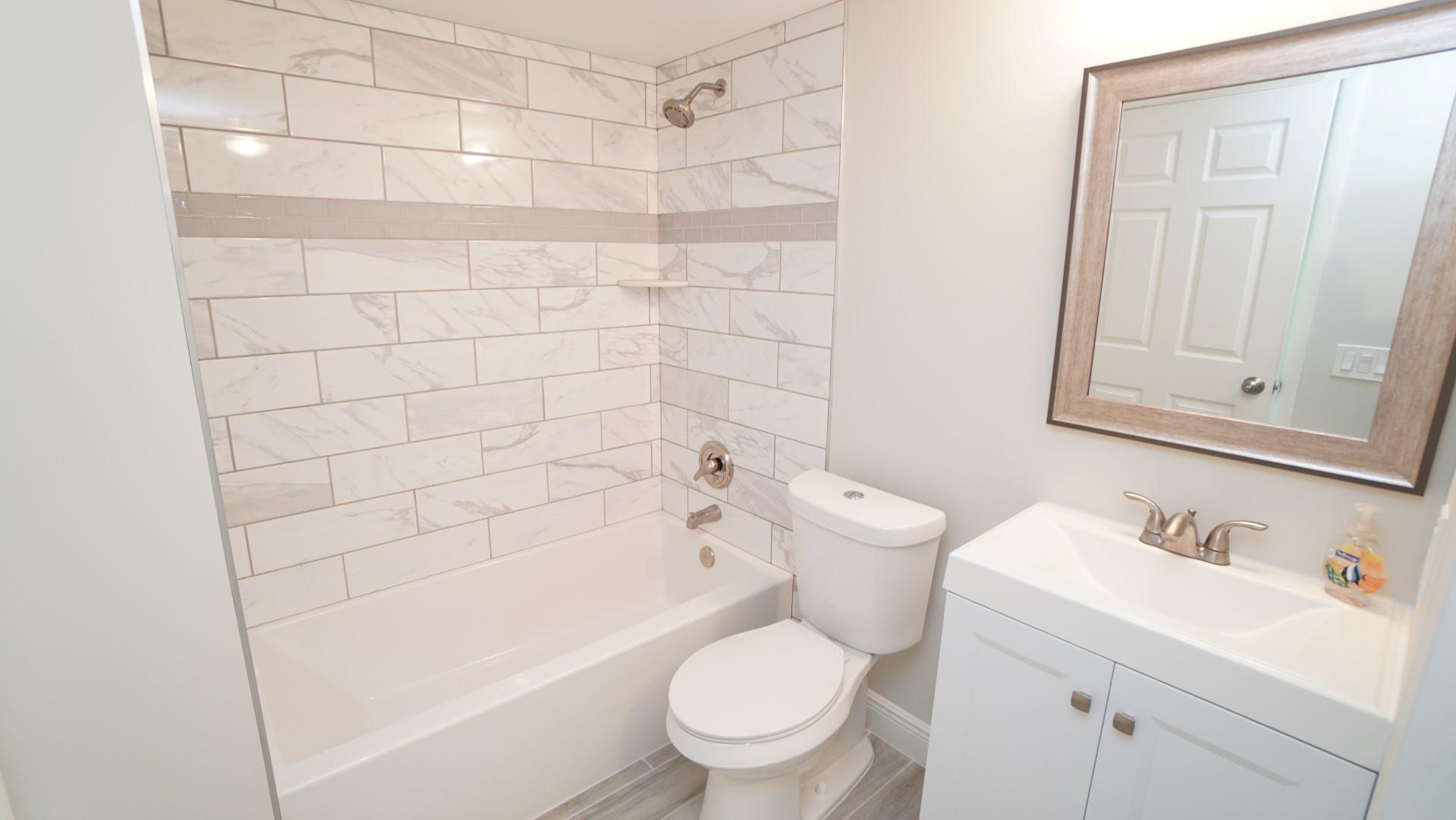 91 Maplecrest Circle Jupiter, FL 33458 - Photo 16 of 27 a bathroom with a sink a toilet and shower