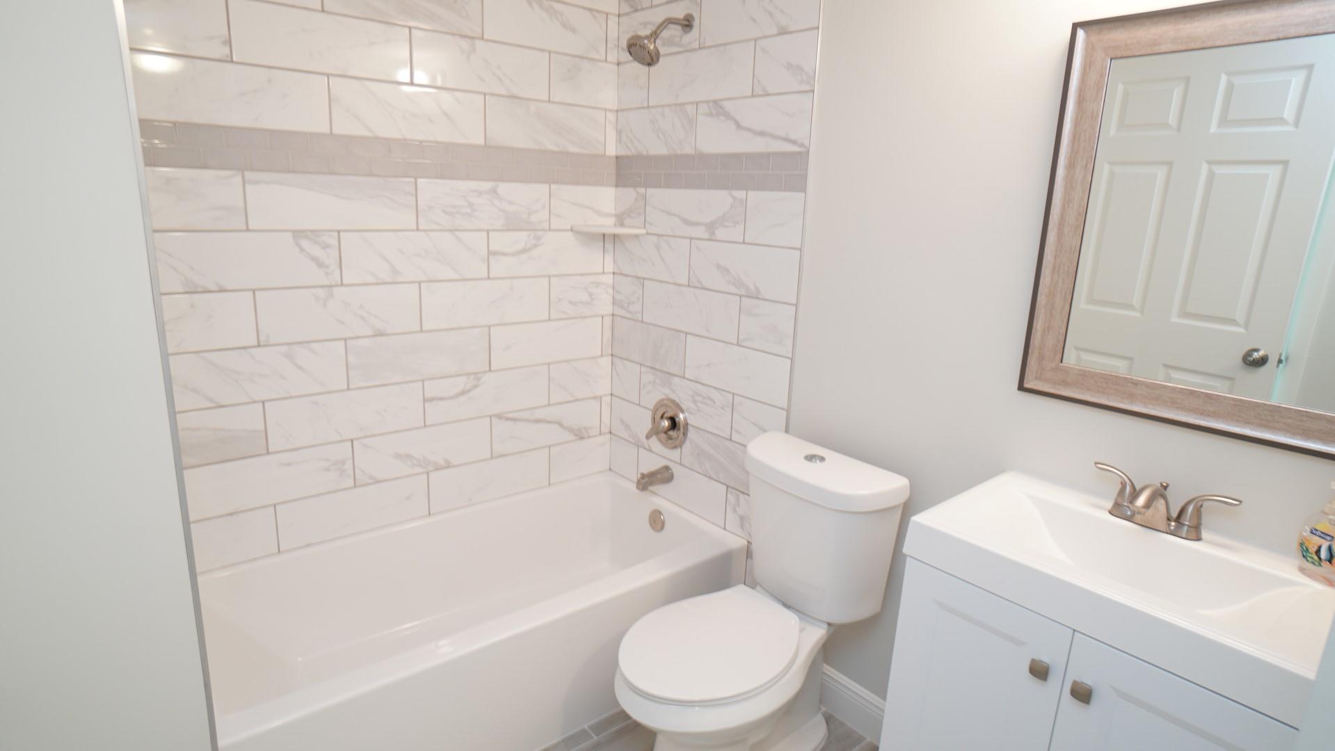 91 Maplecrest Circle Jupiter, FL 33458 - Photo 17 of 27 a bathroom with a toilet sink and bathtub
