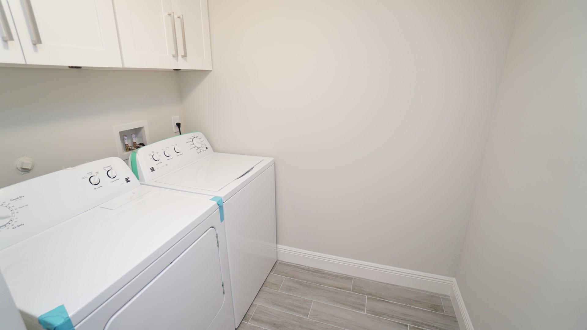 91 Maplecrest Circle Jupiter, FL 33458 - Photo 18 of 27 a utility room with dryer and washer