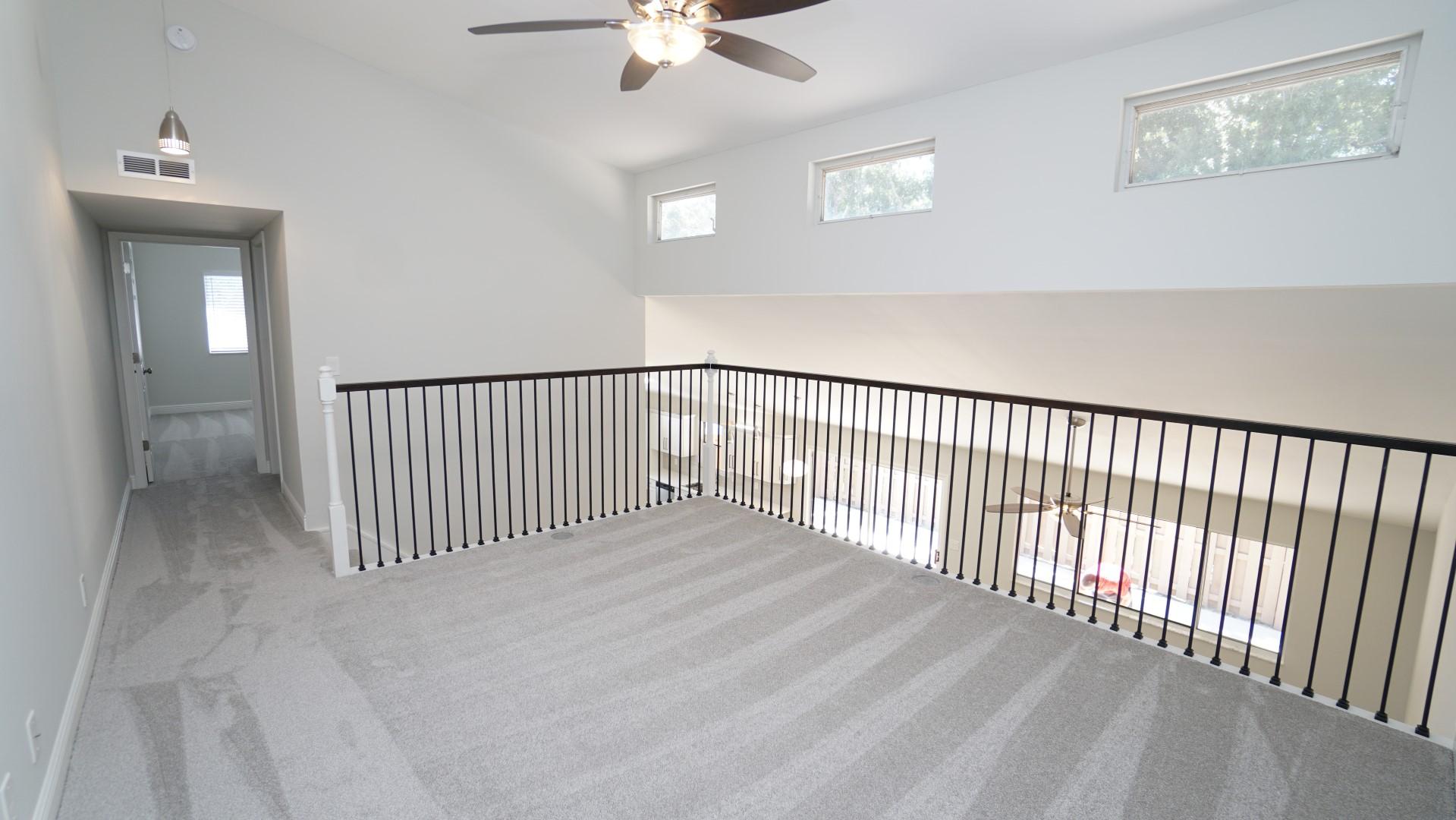 91 Maplecrest Circle Jupiter, FL 33458 - Photo 19 of 27 wooden floor in a hall with a window