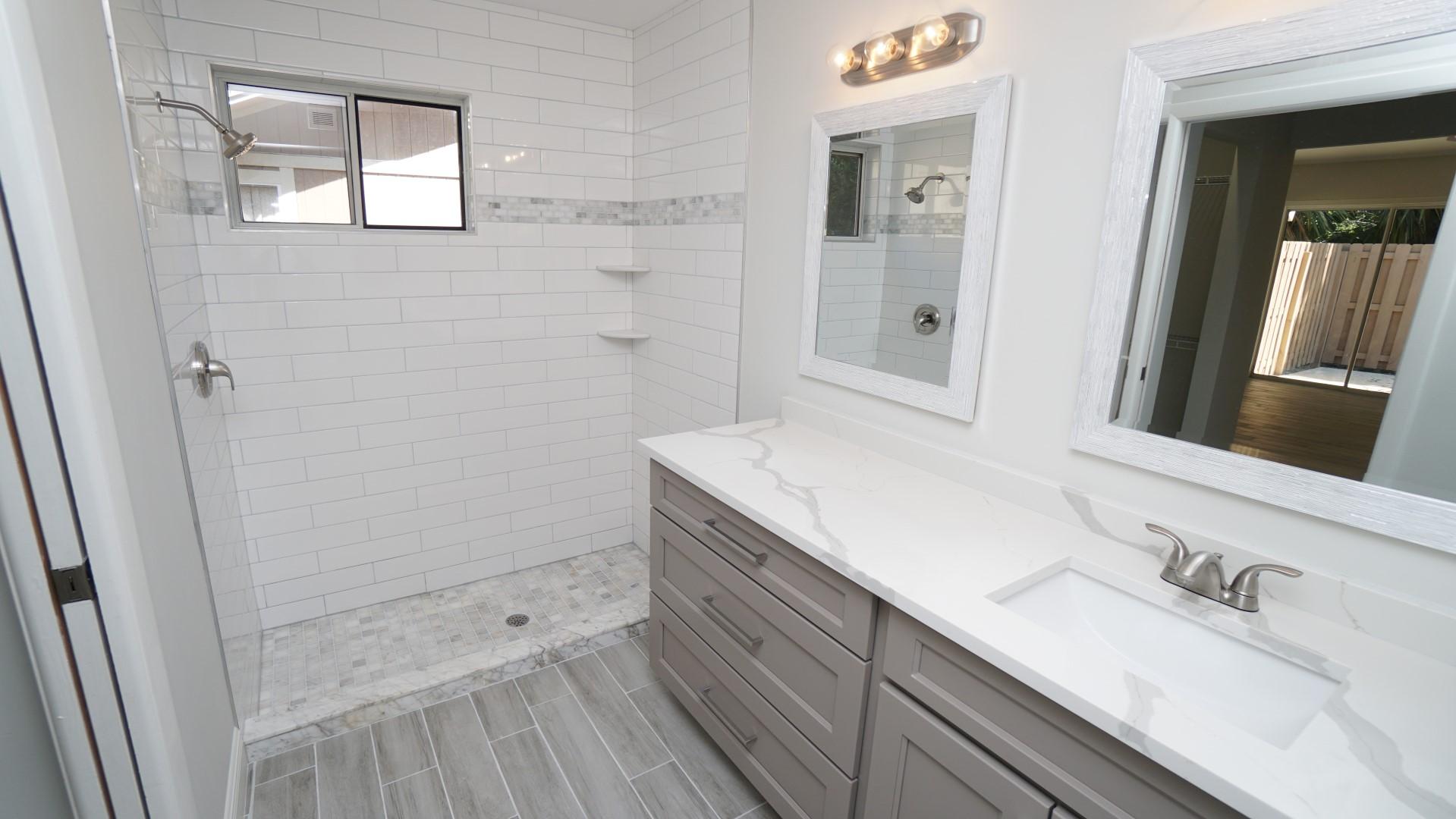 91 Maplecrest Circle Jupiter, FL 33458 - Photo 27 of 27 a bathroom with a sink and a mirror