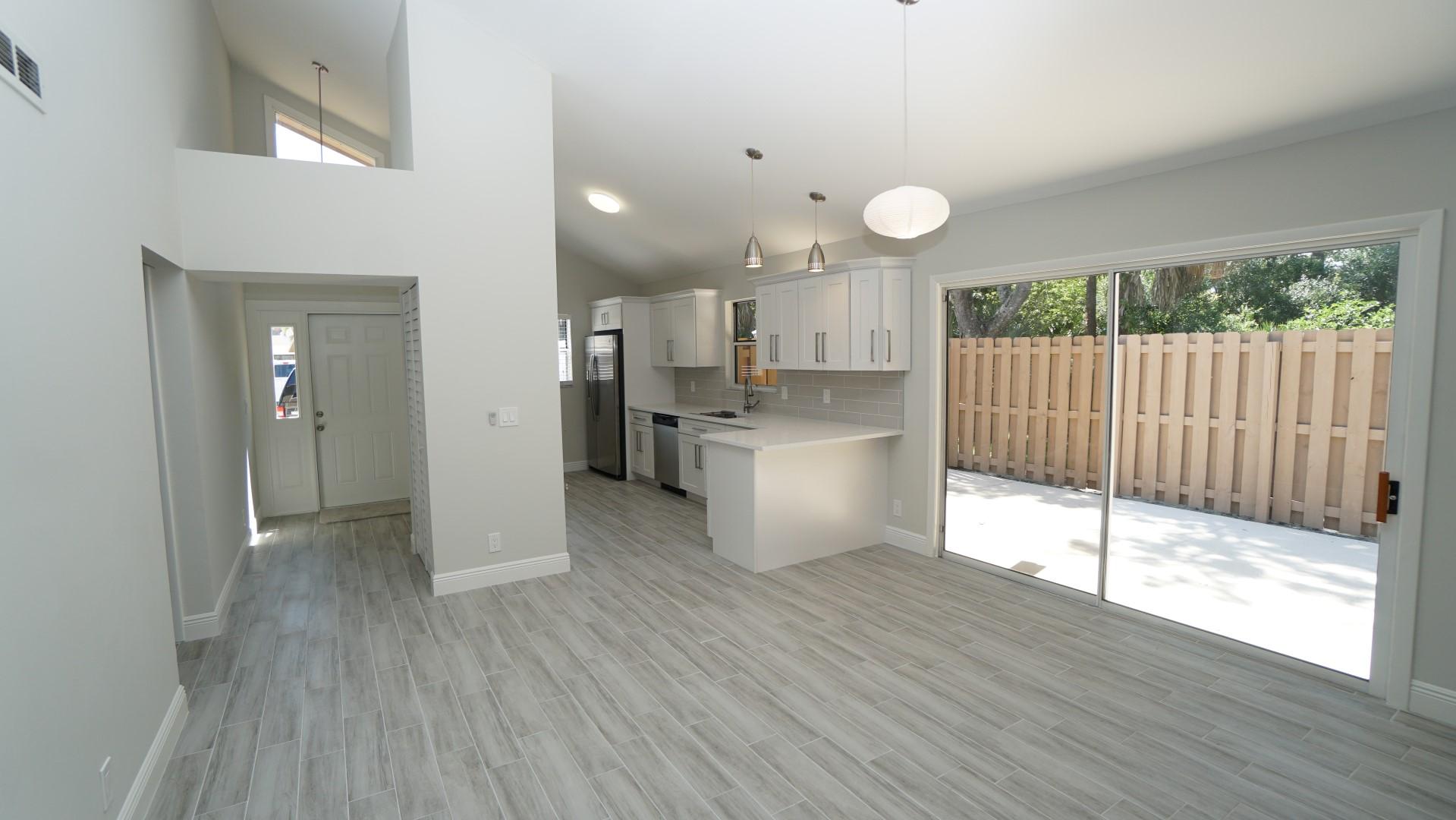 91 Maplecrest Circle Jupiter, FL 33458 - Photo 9 of 27 a view of kitchen with wooden floor and window