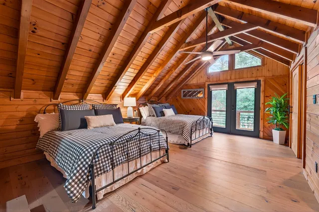 a bathroom with a sink a mirror and shower