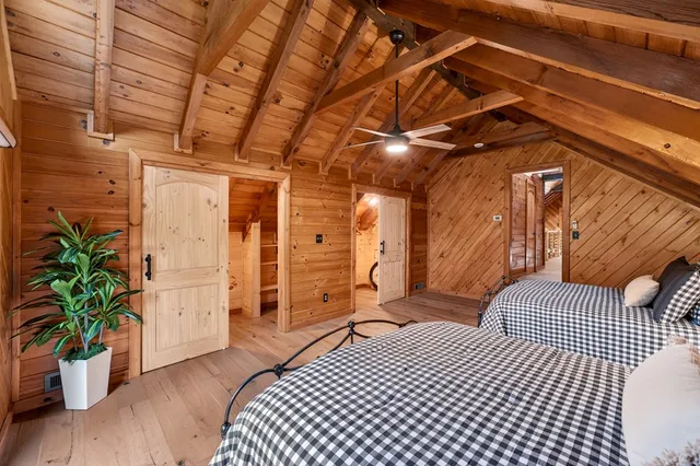 a spacious bathroom with a double vanity sink and a mirror