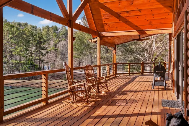 a view of backyard with swimming pool and sitting area