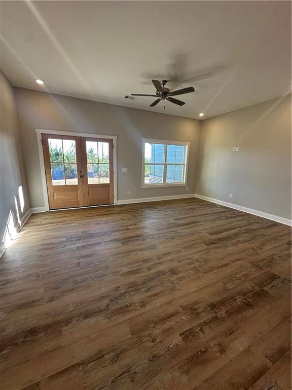 5207 Lee Road Salem, AL 36874 - Photo 3 of 23 Unfurnished room with french doors, dark wood finished floors, a ceiling fan, and recessed lighting