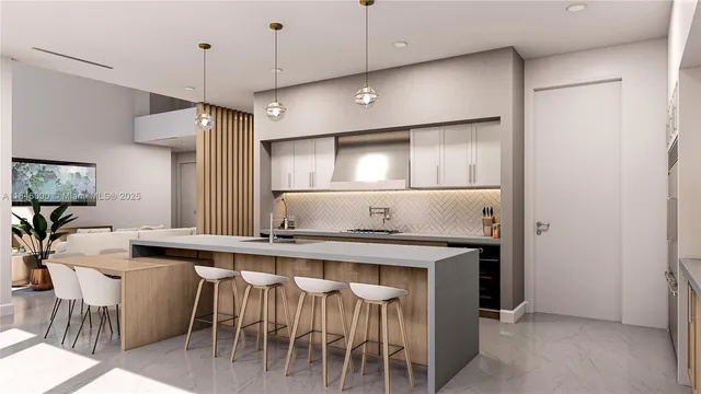 a kitchen with stainless steel appliances granite countertop a sink a stove a refrigerator and island with wooden floor