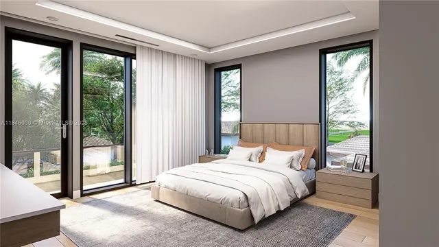 a bedroom with a bed and large window