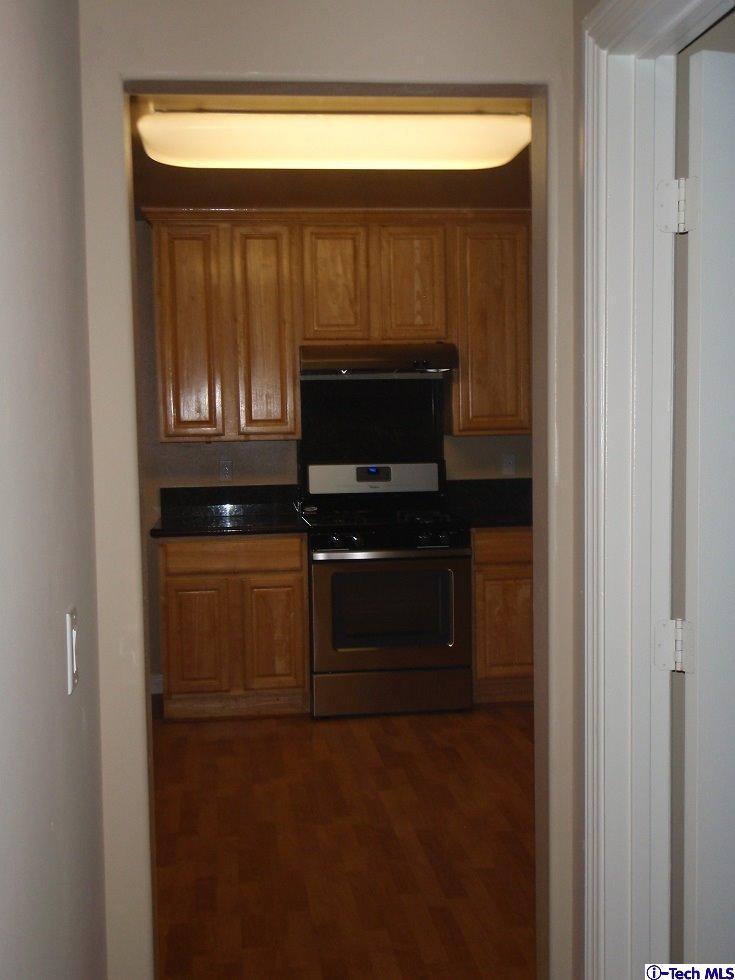 11533 Ranchito Street El Monte, CA 91732 - Photo 12 of 30 a kitchen with a stove and a microwave