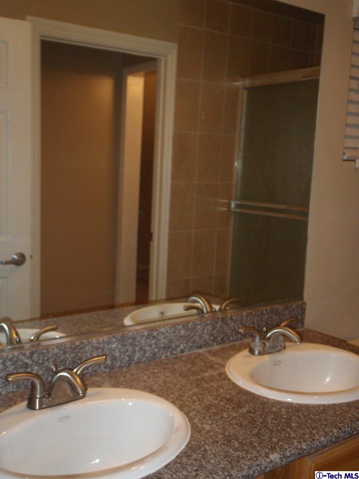 11533 Ranchito Street El Monte, CA 91732 - Photo 13 of 30 a bathroom with a sink and a mirror