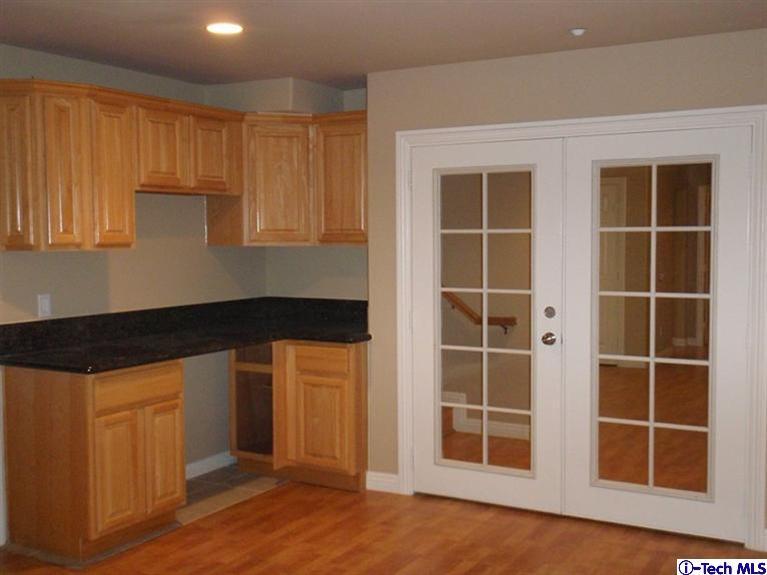 11533 Ranchito Street El Monte, CA 91732 - Photo 15 of 30 a kitchen with a refrigerator and more cabinets