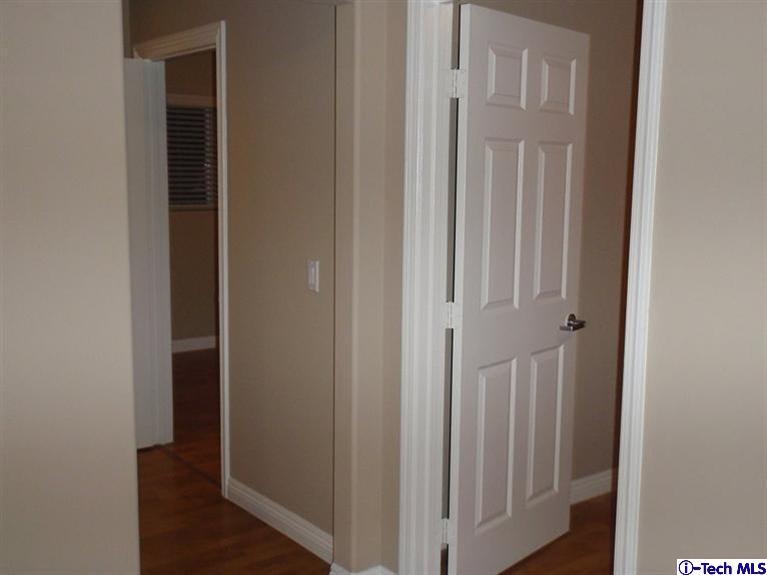 11533 Ranchito Street El Monte, CA 91732 - Photo 3 of 30 a view of a hallway with wooden floor