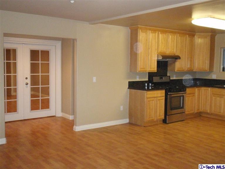 11533 Ranchito Street El Monte, CA 91732 - Photo 22 of 30 a kitchen with a sink a stove and cabinets