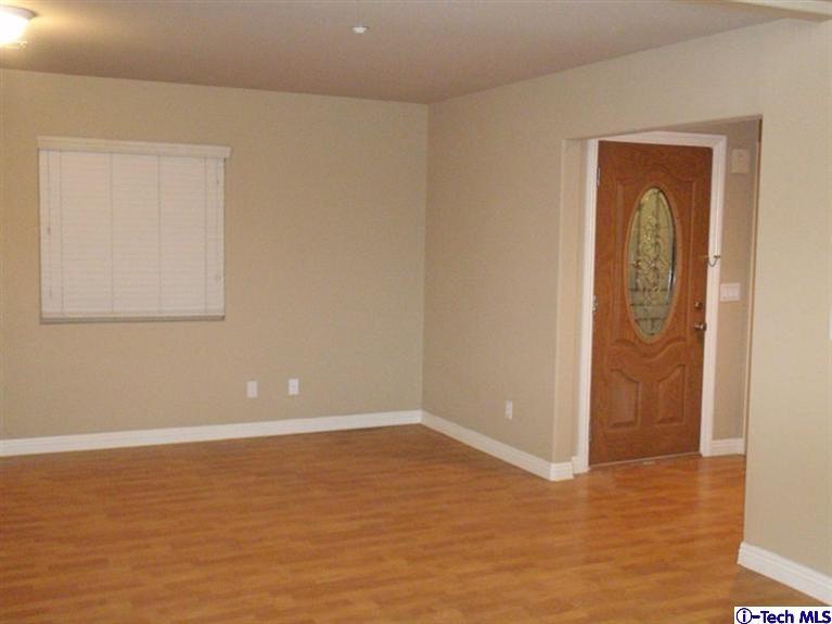 11533 Ranchito Street El Monte, CA 91732 - Photo 23 of 30 an empty room with wooden floor and closet