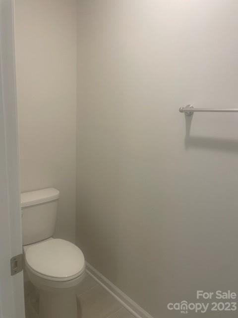 314 Olympia Way York, SC 29745 - Photo 11 of 19 a white toilet sitting next to a shower
