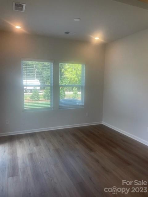 314 Olympia Way York, SC 29745 - Photo 7 of 19 an empty room with wooden floor and windows