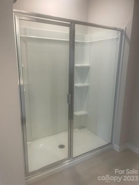 314 Olympia Way York, SC 29745 - Photo 10 of 19 a bathroom with a glass shower door