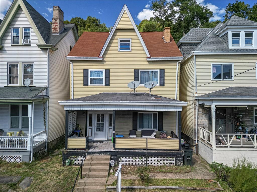 33 5th Street Pittsburgh, PA 15215 - Photo 26 of 32 a front view of a house with garden and porch