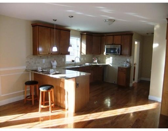 Lot 12 Bethany Road Monson, MA 01057 - Photo 12 of 25 a kitchen with stainless steel appliances granite countertop a sink stove and cabinets
