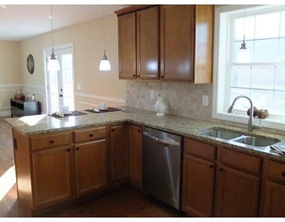 Lot 12 Bethany Road Monson, MA 01057 - Photo 14 of 25 a kitchen with granite countertop stainless steel appliances a sink and cabinets