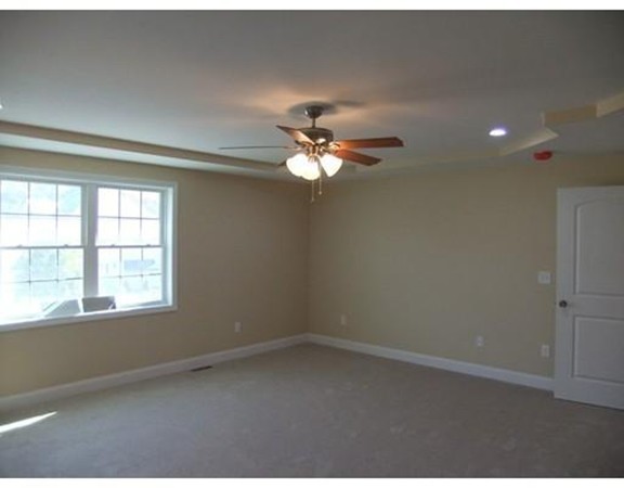 Lot 12 Bethany Road Monson, MA 01057 - Photo 19 of 25 an empty room with a window and a ceiling fan