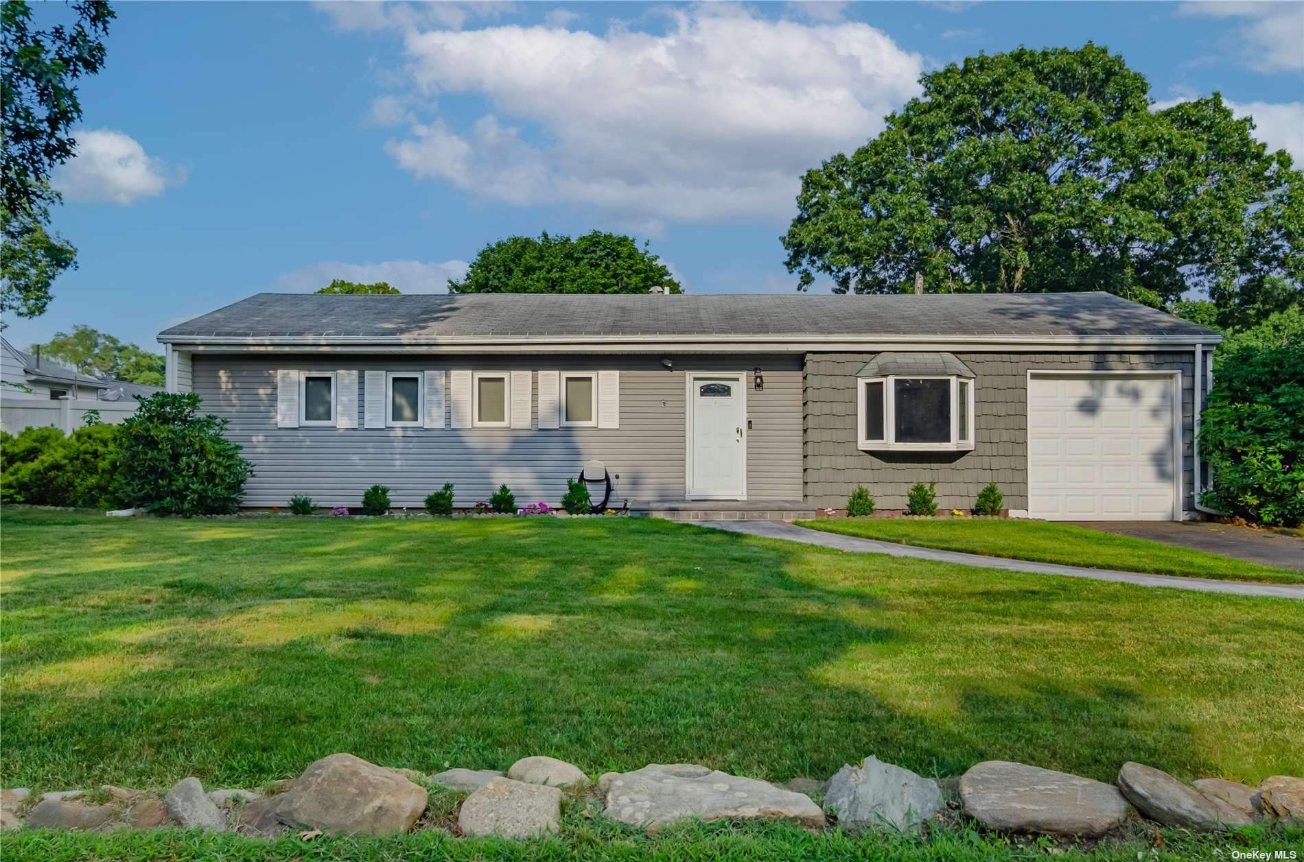 115 Dare Road Selden, NY 11784 - Photo 1 of 1 a front view of house with yard and green space