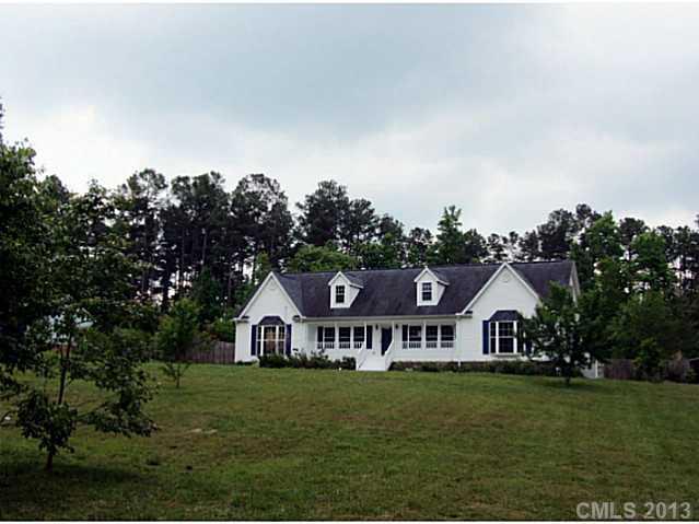 649 White Pine Road Catawba, SC 29704 - Photo 1 of 16 a view of a house with garden and trees
