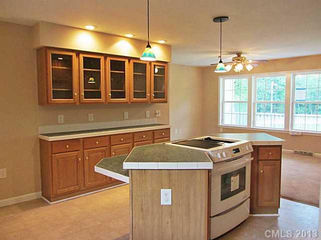 649 White Pine Road Catawba, SC 29704 - Photo 13 of 16 a kitchen that has a stove and a table in it