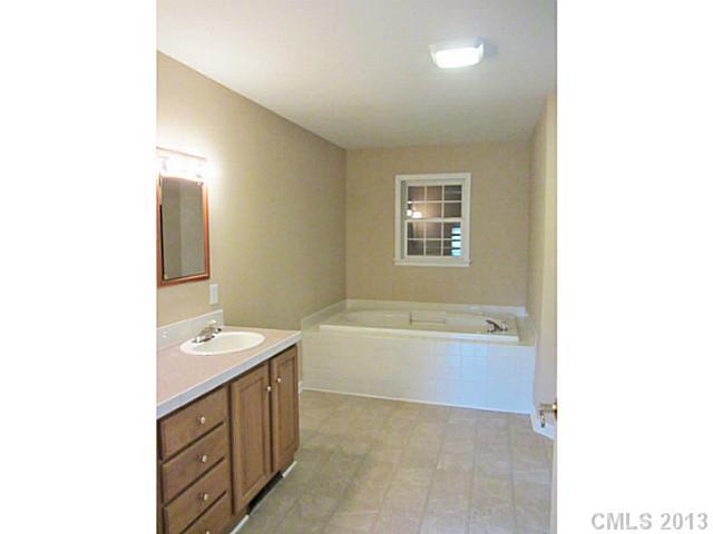 649 White Pine Road Catawba, SC 29704 - Photo 15 of 16 a bathroom with a tub sink and mirror