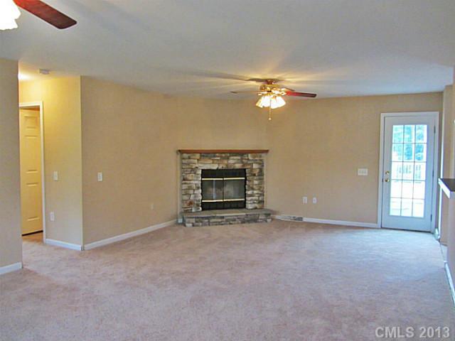 649 White Pine Road Catawba, SC 29704 - Photo 10 of 16 a view of a room with a ceiling fan and a fireplace