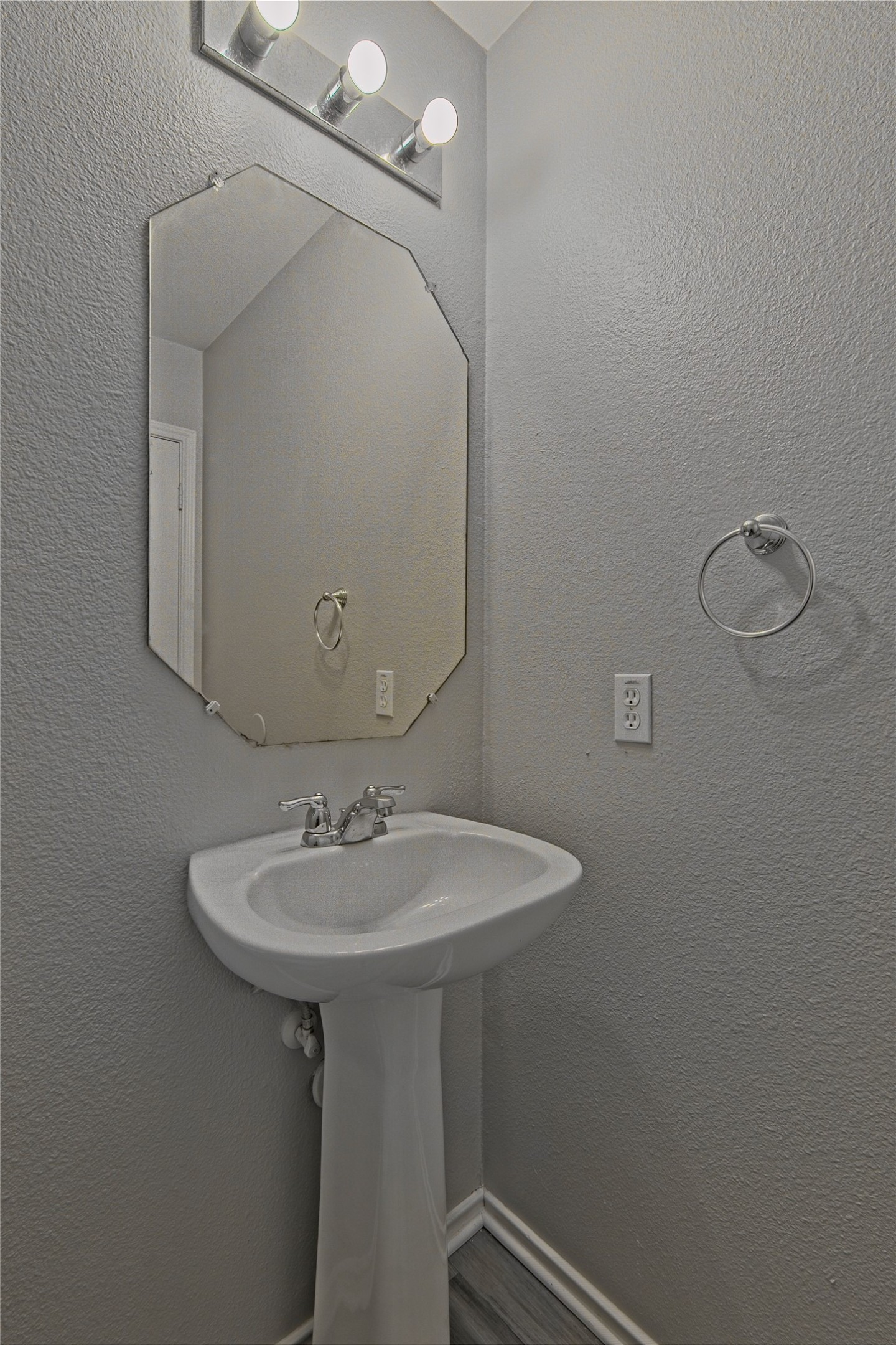 232 Brickyard Lane Jarrell, TX 76537 - Photo 16 of 31 A streamlined pedestal sink complements the clean lines of this modern bathroom.