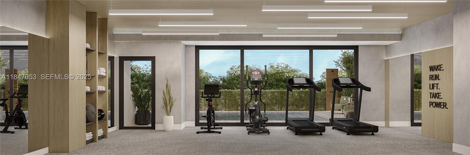 758 Northwest 2nd Street, Unit 503 Miami, FL 33128 - Photo 12 of 16 a view of a room with gym equipment