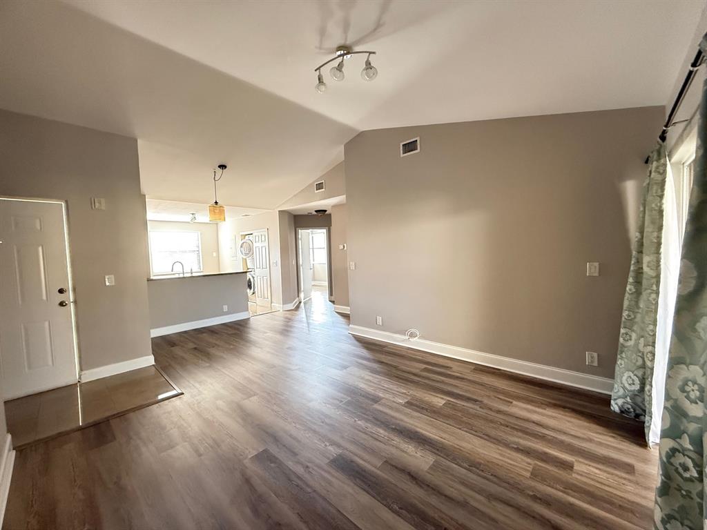 5781 Riverside Drive, Unit 201 Coral Springs, FL 33067 - Photo 13 of 23 wooden floor in an empty room with a window