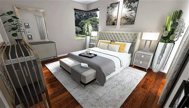 a bedroom with a bed and a flat screen tv