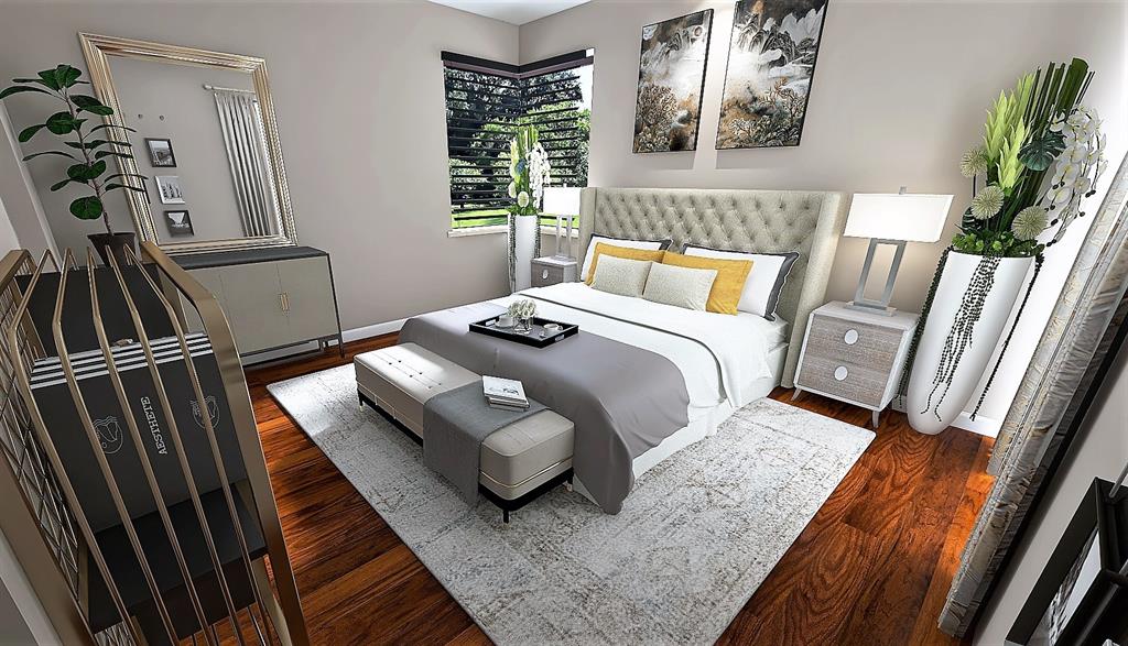 5781 Riverside Drive, Unit 201 Coral Springs, FL 33067 - Photo 22 of 23 a bedroom with a bed and a flat screen tv