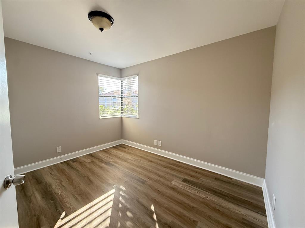 5781 Riverside Drive, Unit 201 Coral Springs, FL 33067 - Photo 6 of 23 an empty room with windows