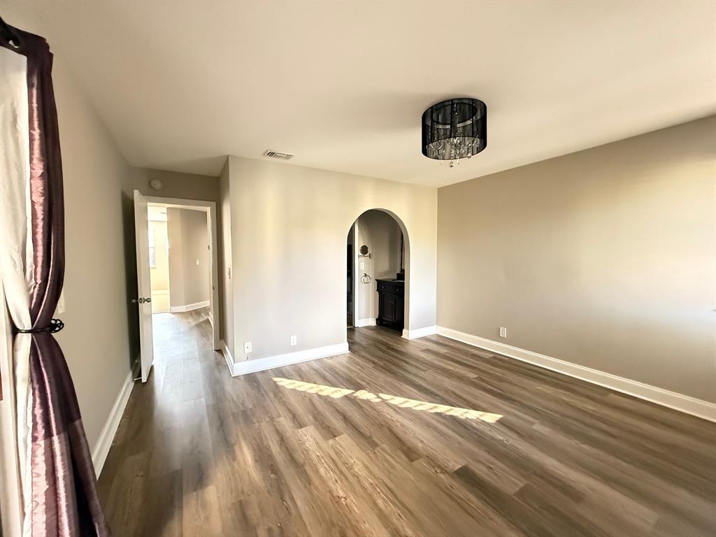 5781 Riverside Drive, Unit 201 Coral Springs, FL 33067 - Photo 10 of 23 a view of a livingroom with wooden floor and a large window