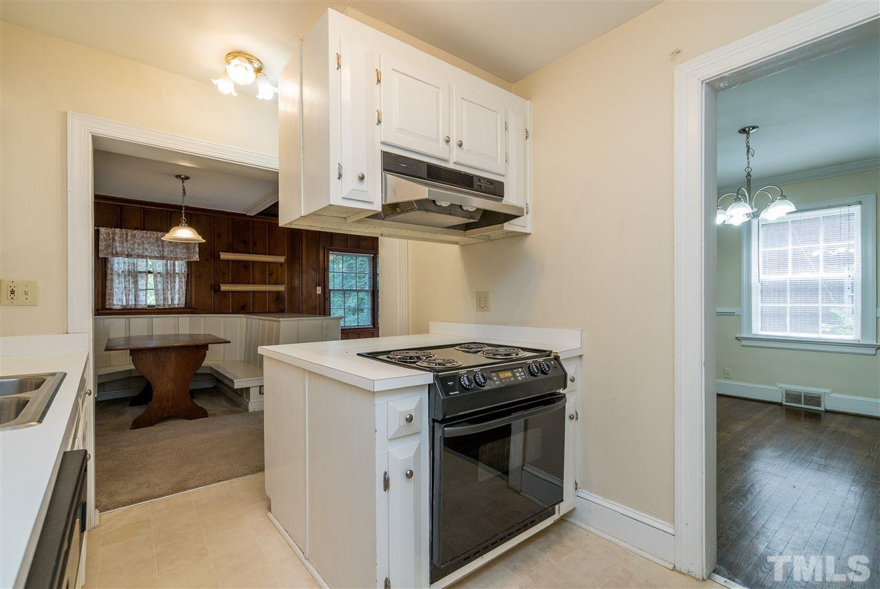 2254 The Circle Raleigh, NC 27608 - Photo 9 of 22 a kitchen with stainless steel appliances a stove a sink and a microwave