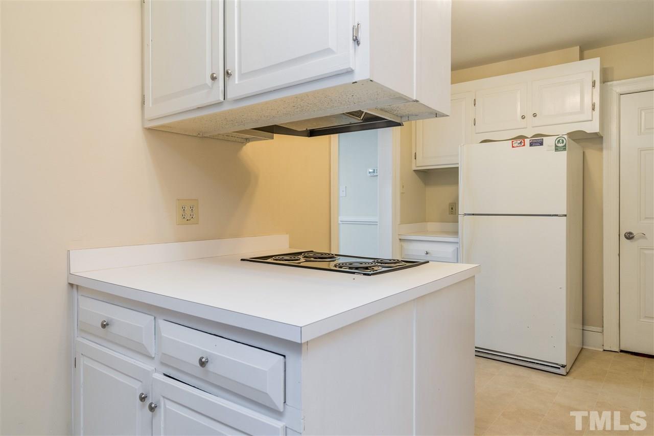 2254 The Circle Raleigh, NC 27608 - Photo 10 of 22 a kitchen with a refrigerator and a stove