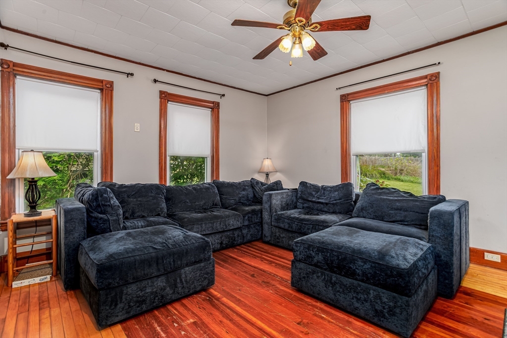 54 Charles Street Gardner, MA 01440 - Photo 12 of 40 a living room with furniture and a large window