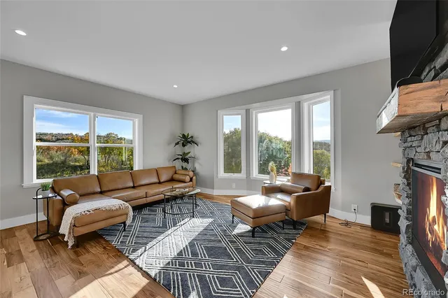 a living room with furniture fireplace and a flat screen tv