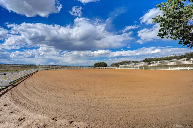 an aerial view of a house with a lake view