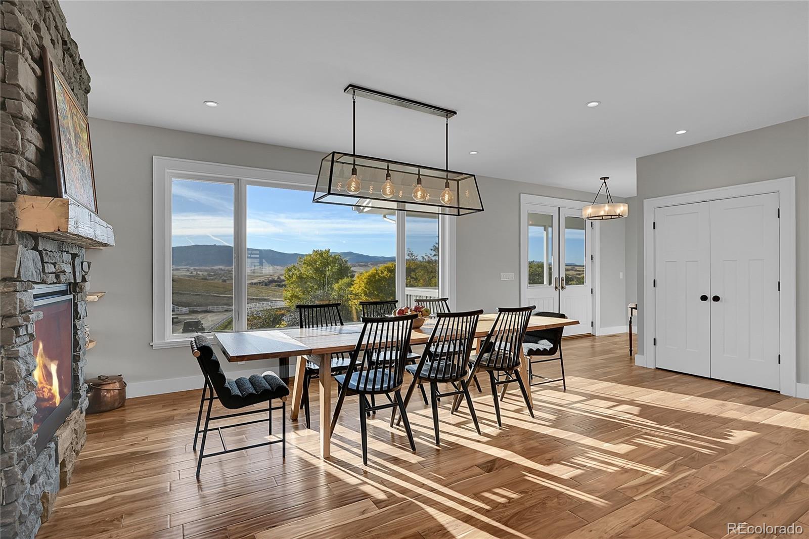 810 North Perry Park Road Sedalia, CO 80135 - Photo 9 of 46 a view of a dining room with furniture window and outside view