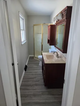 a bathroom with sink and mirror