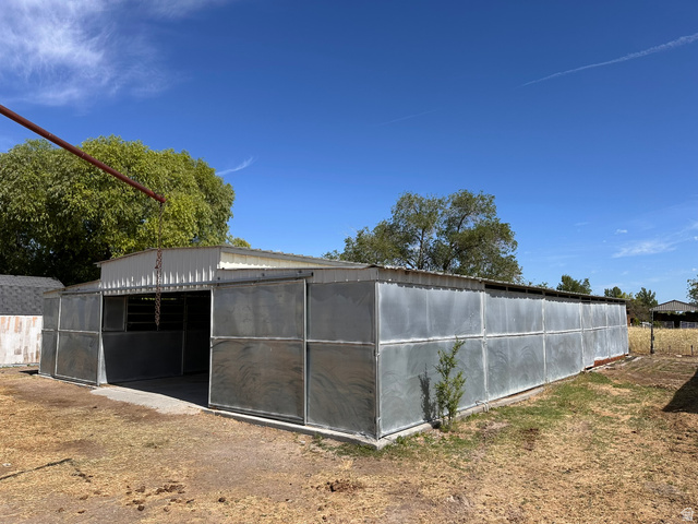 3732 Campbell Road Tooele, UT 84074 - Photo 52 of 69 Metal-clad outbuilding with an open-front section and a full-length metal roof